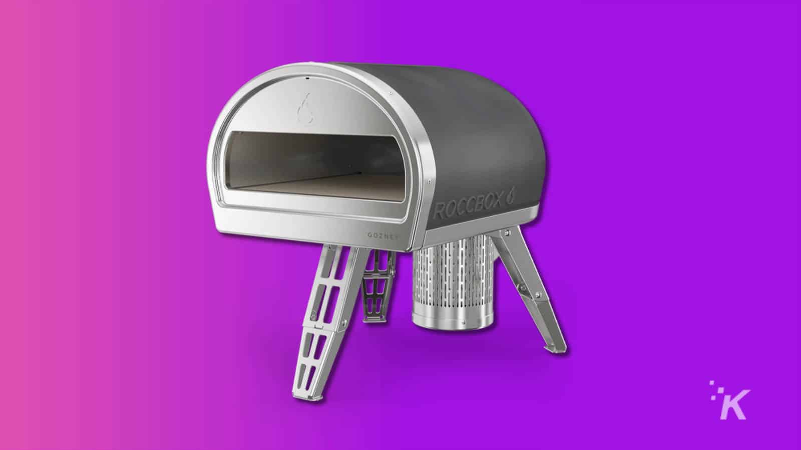 gozney roccbox outdoor pizza oven on purple background