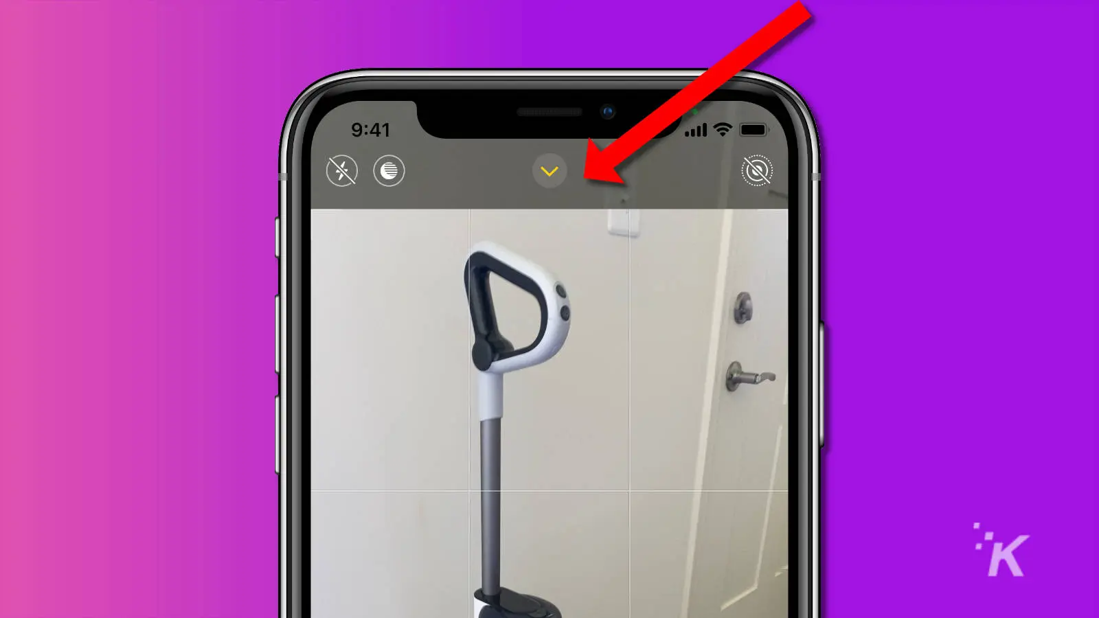 screenshot of iphone camera app showing to tap the arrow icon at the top to get to settings