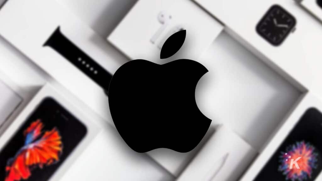 apple logo with apple products blurred in the background