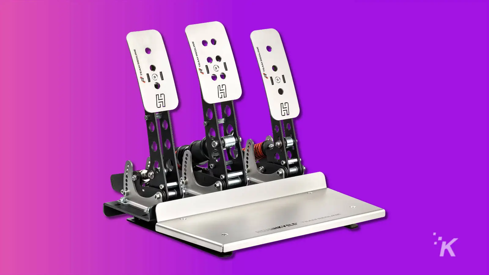 racing sim pedals on purple background