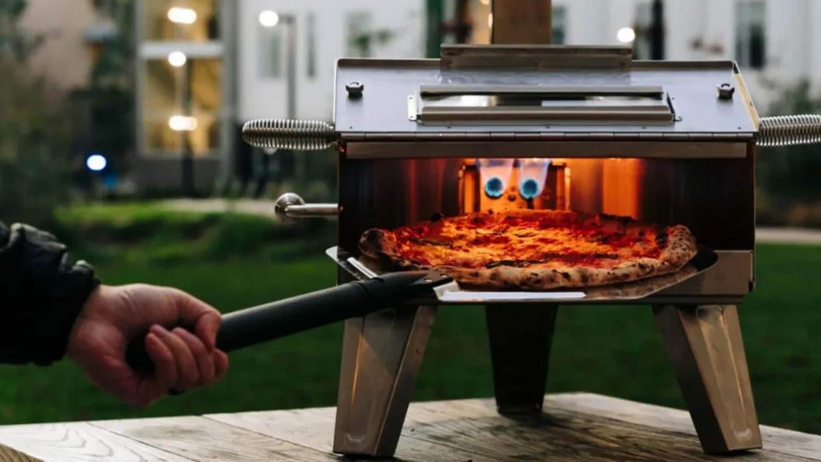 scorpio pizza oven crowdfunding campaign on a picnic table