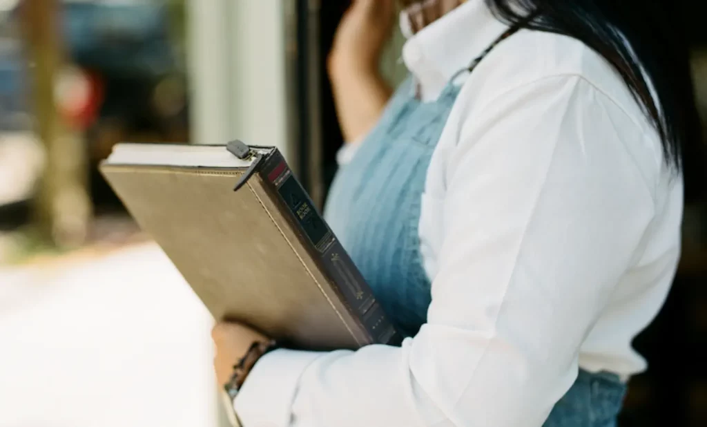 Image of someone holding a twelve south bookbook macbook pro case