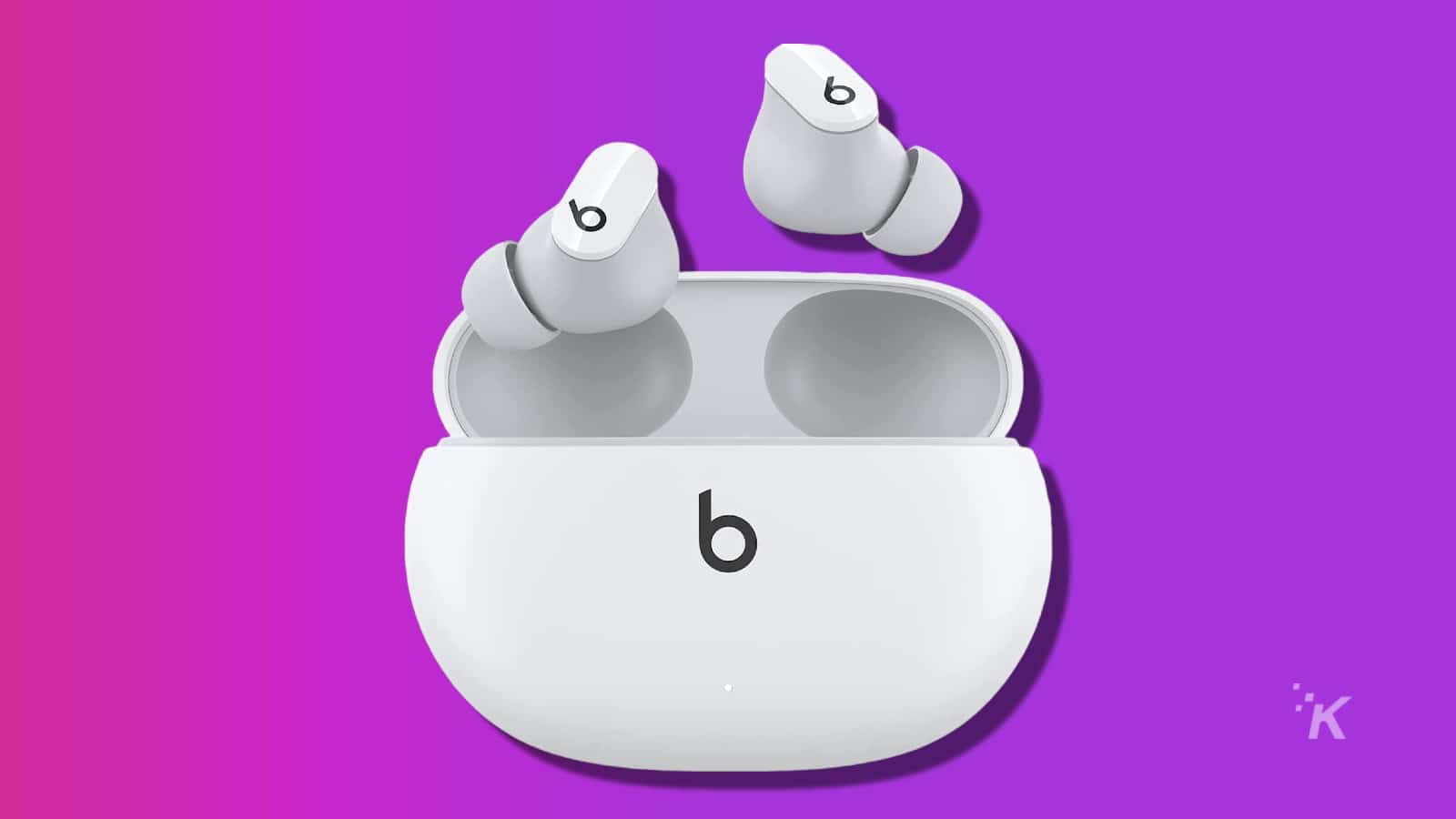 white beats studio buds on a purple background