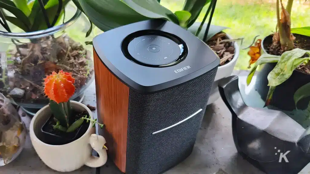 nice bluetooth speaker with wood paneling on table