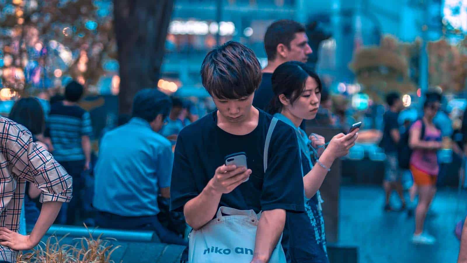 Japanese person on smartphone in park