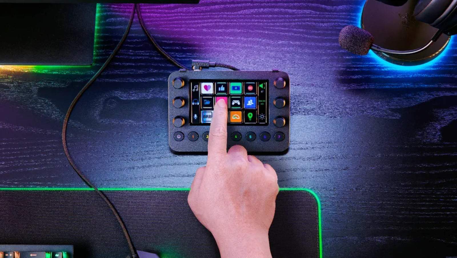 Finger pressing a button on the razer stream controller