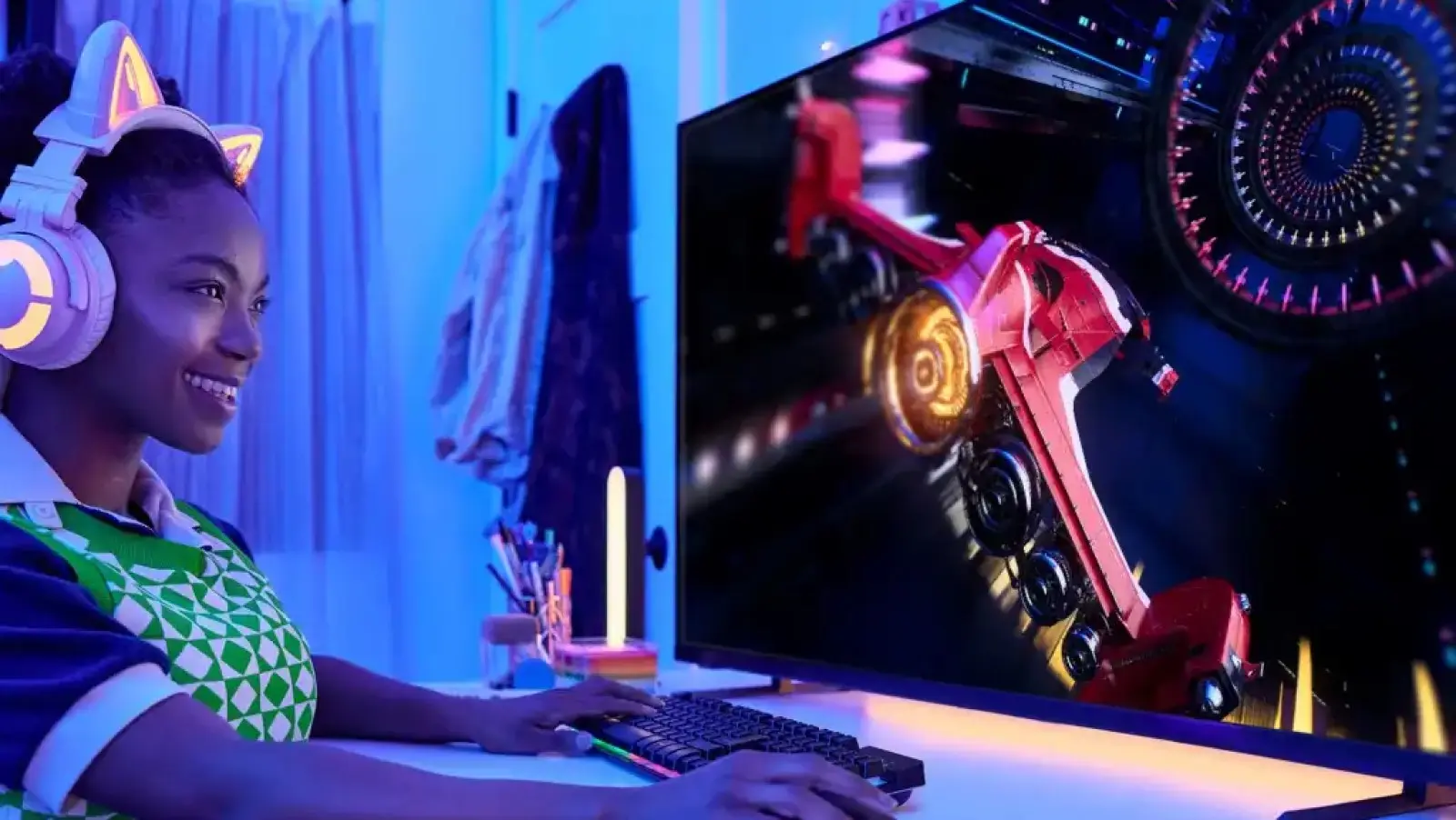 black teenager playing video games on the vizio m-series quantum tv