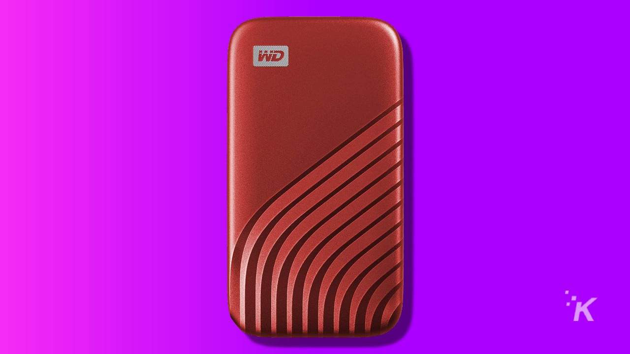wd passport external ssd hard drive on purple background