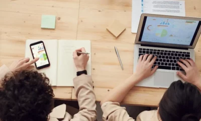 people working on o a desk time tracking