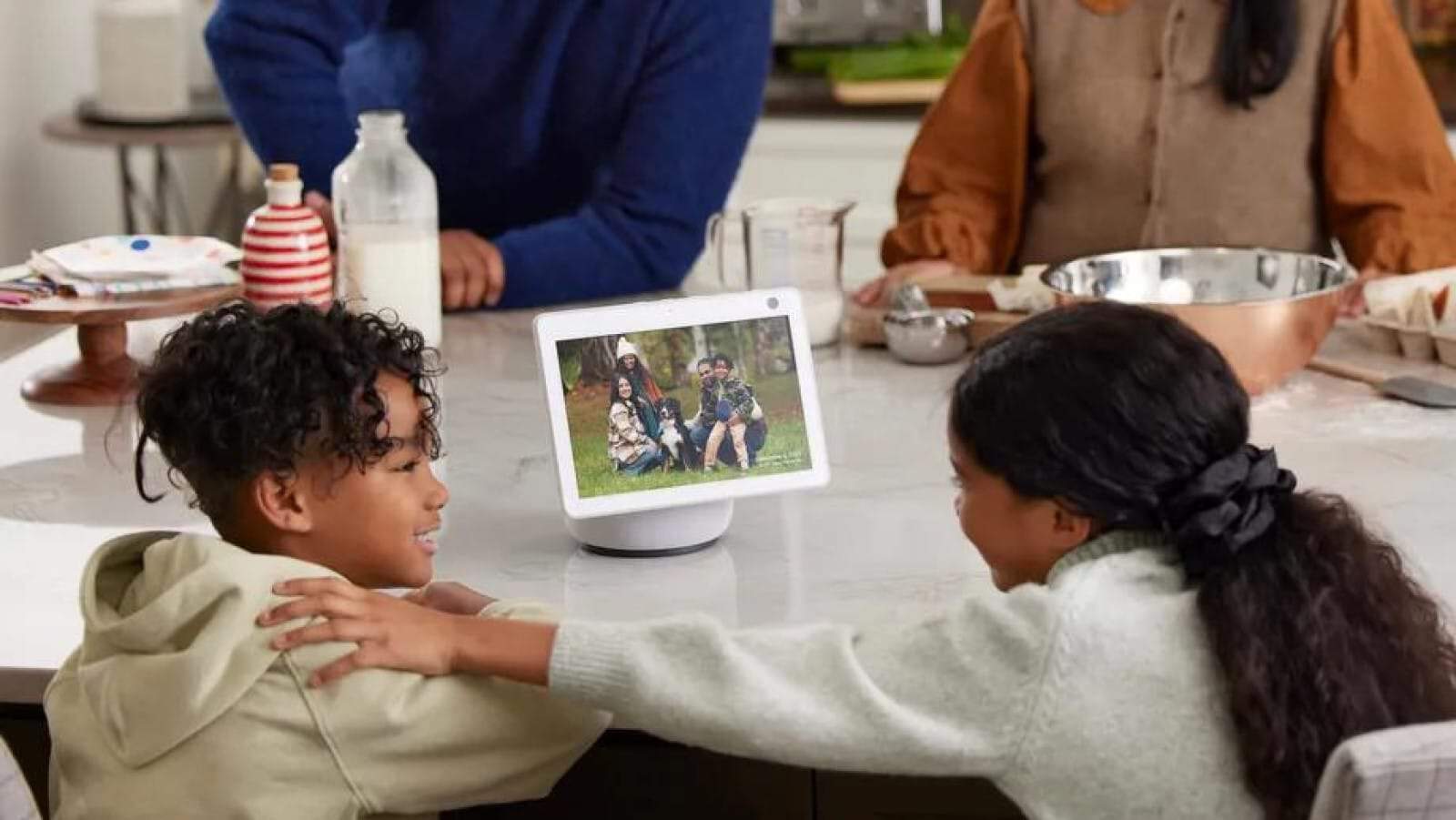 Echo show device on table showing family photos