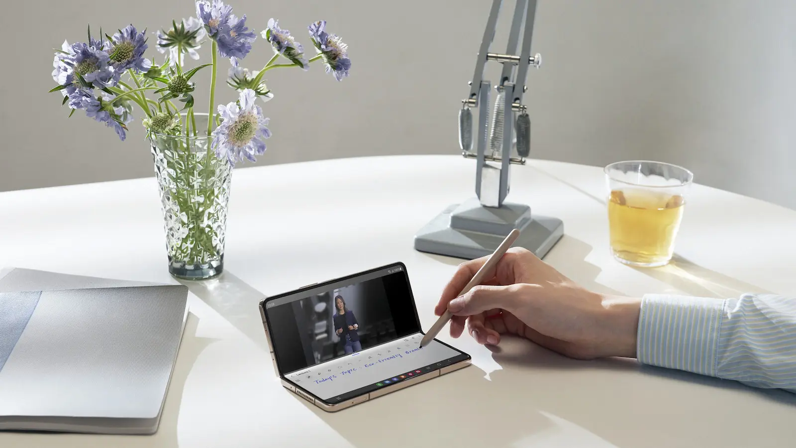 samsung galaxy z fold 4 in beige being used on a table