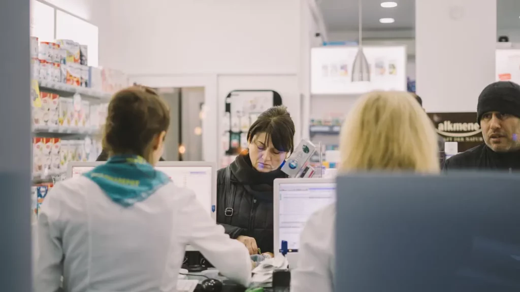 people working at a pharmacy