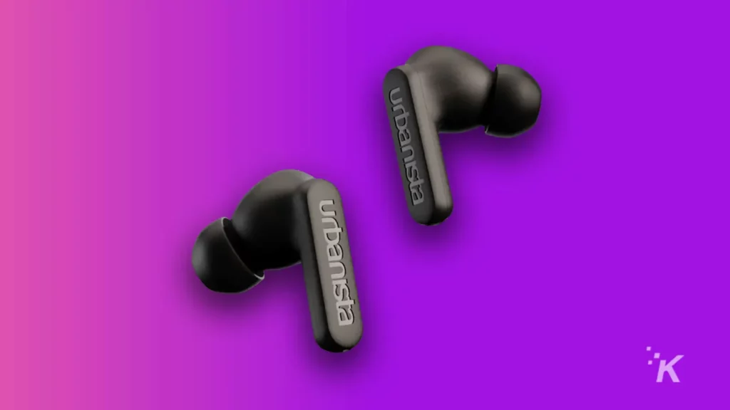 urbanista solar powered earbuds on purple background