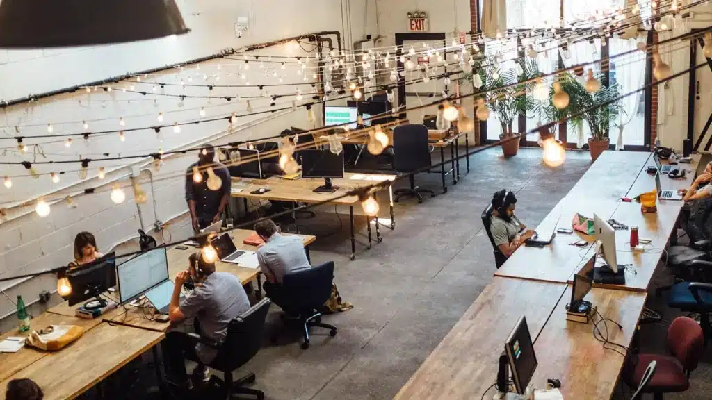 room full of people sitting at workstations