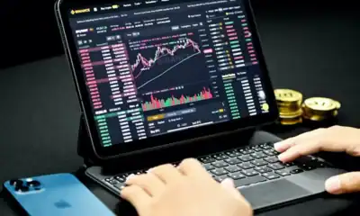 computer with charts of investing in crypto