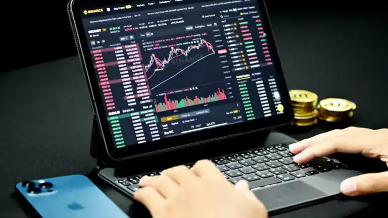 computer with charts of investing in crypto