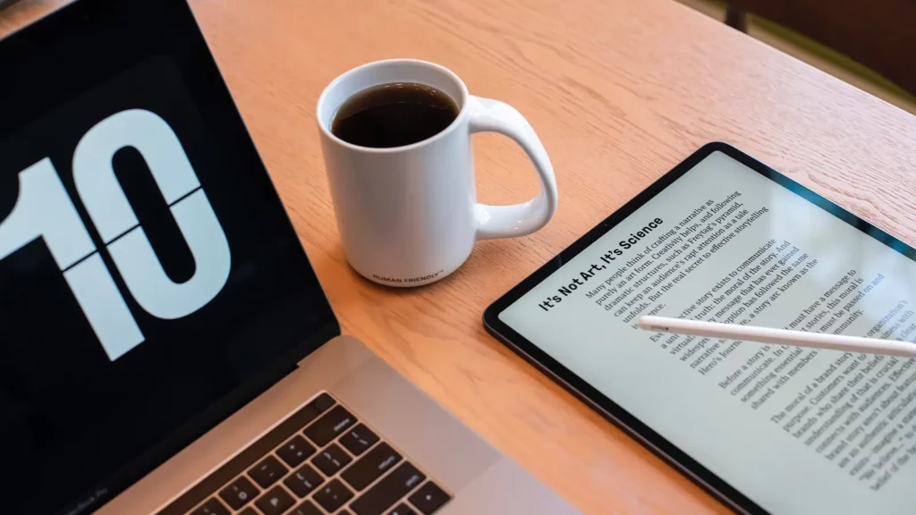 computer and cup of coffee with pdf reader