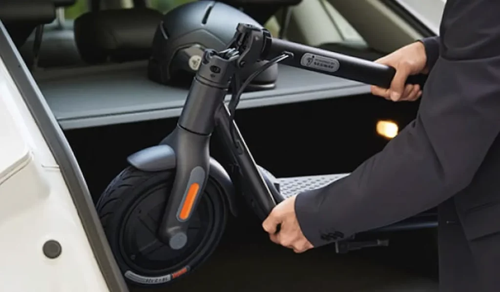 man loading segway ninebot scooter in truck