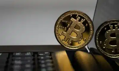 A Bitcoin on a laptop