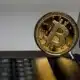 A Bitcoin on a laptop