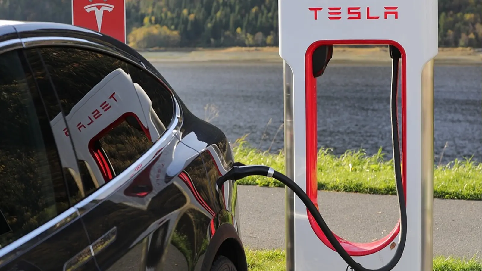 tesla car charging at charging station