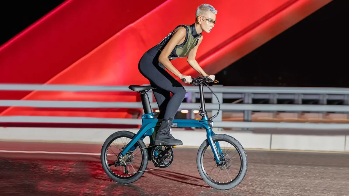 woman riding an ebike on the road.