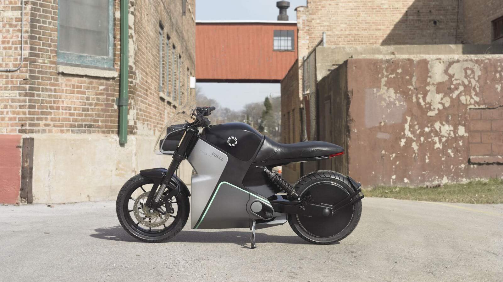 fuell fllow electric motorbike in an industrial neighborhood