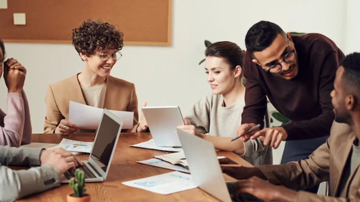 happy employees sitting in a meeting