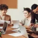 happy employees sitting in a meeting