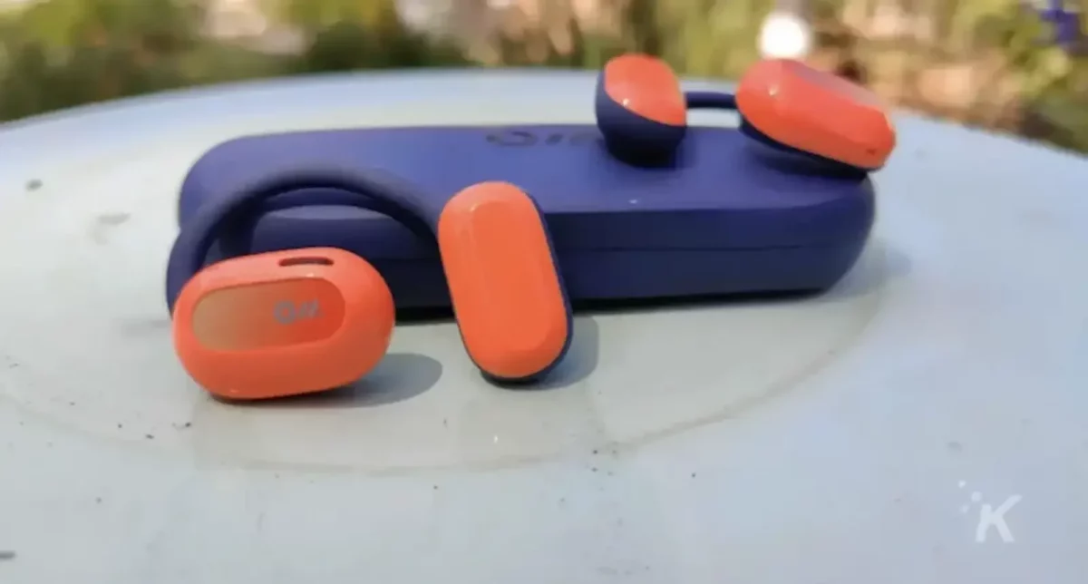 Oladance-wearable-stereo-earbuds-outside-on-a-table