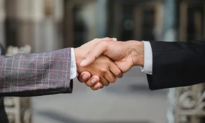 two people shaking hands partnership