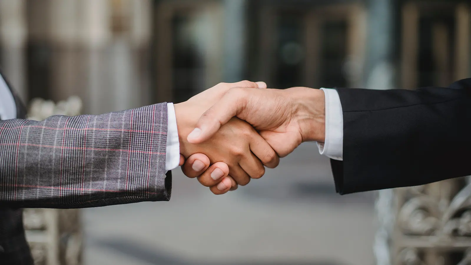 two people shaking hands partnership