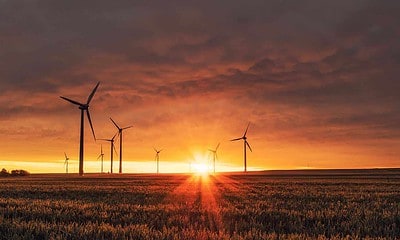 wind turbines during a sunset