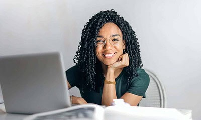 student in front of a laptop.