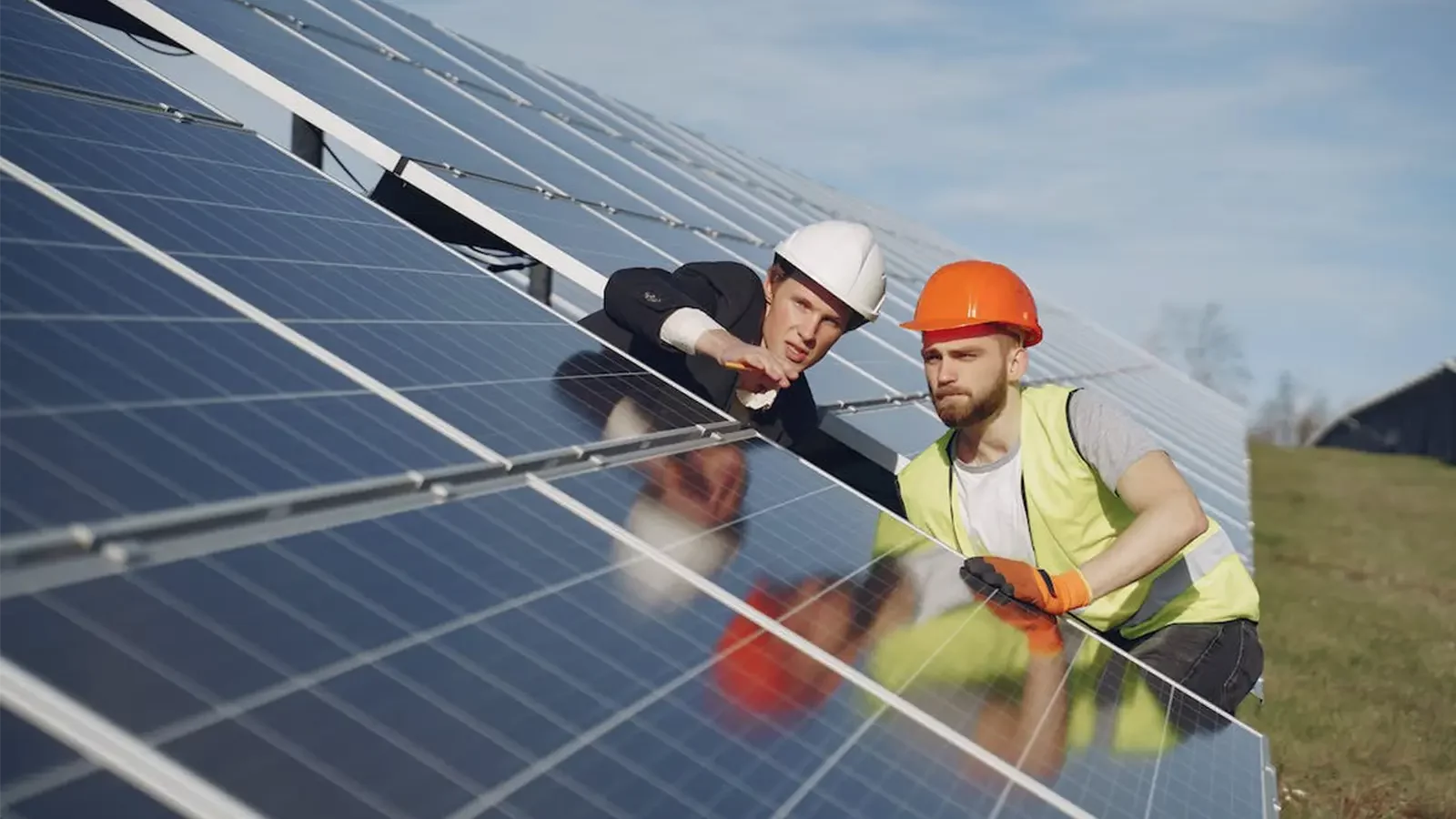 workers working on solar panels