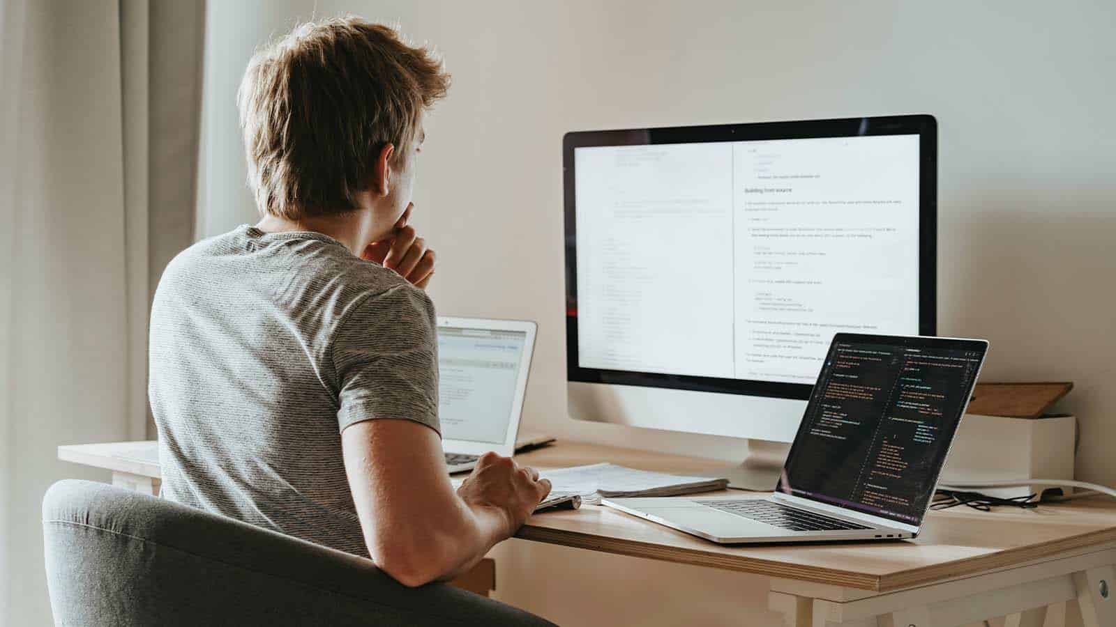 Laravel developer in front of a computer 