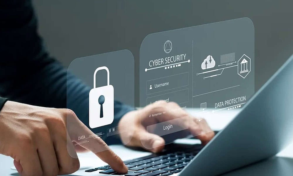 person on computer with cybersecurity prompt