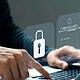 person on computer with cybersecurity prompt