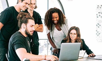 people in front of a computer. Starting a business