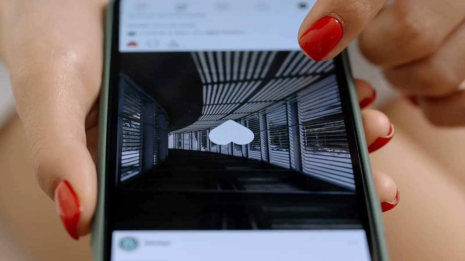 Person clicking likes on phone