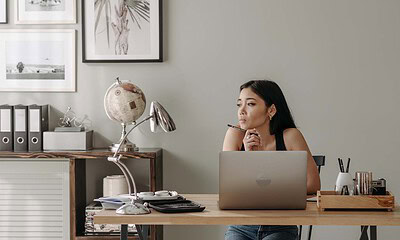 Remote worker sitting in front of a computer