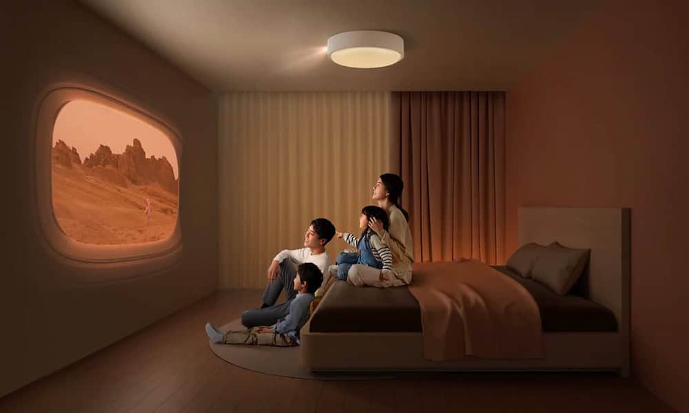 xgimi magic lamp projector with family sitting in bedroom