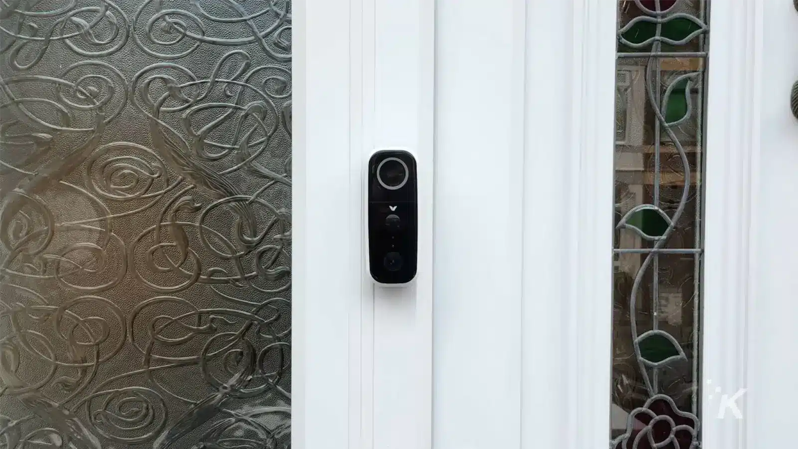 Adobe video doorbell on side of door