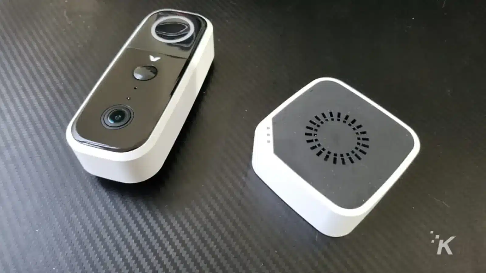 Adobe video doorbell on black desk