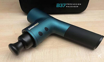 B37-Percussion massager on table with case