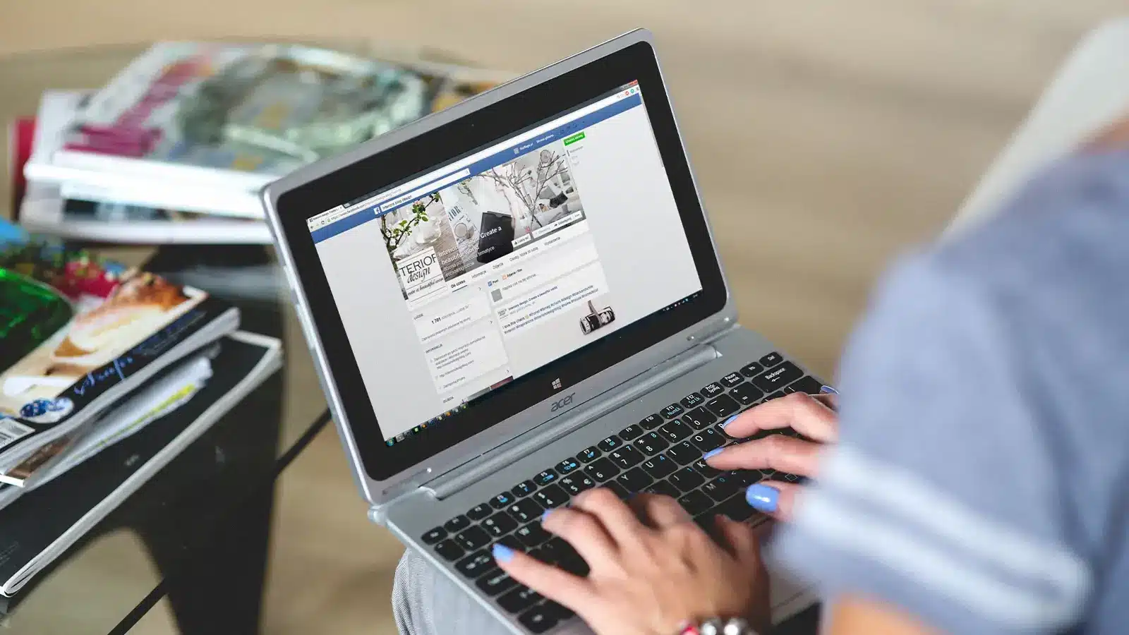 Person typing on laptop using facebook ads