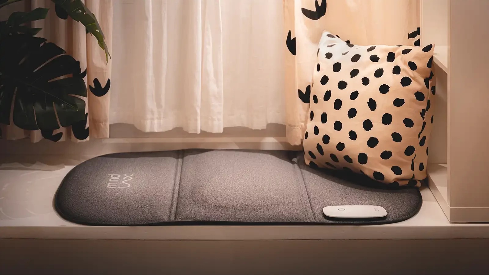 Sleeping pad on floor with a pillow