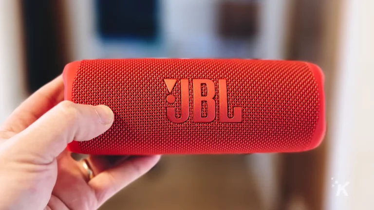 JBL Flip 6 portable speaker red in hand