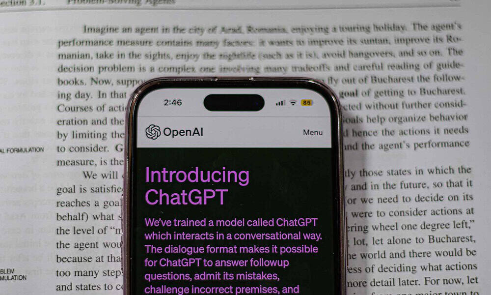 ChatGPT on phone in front of text