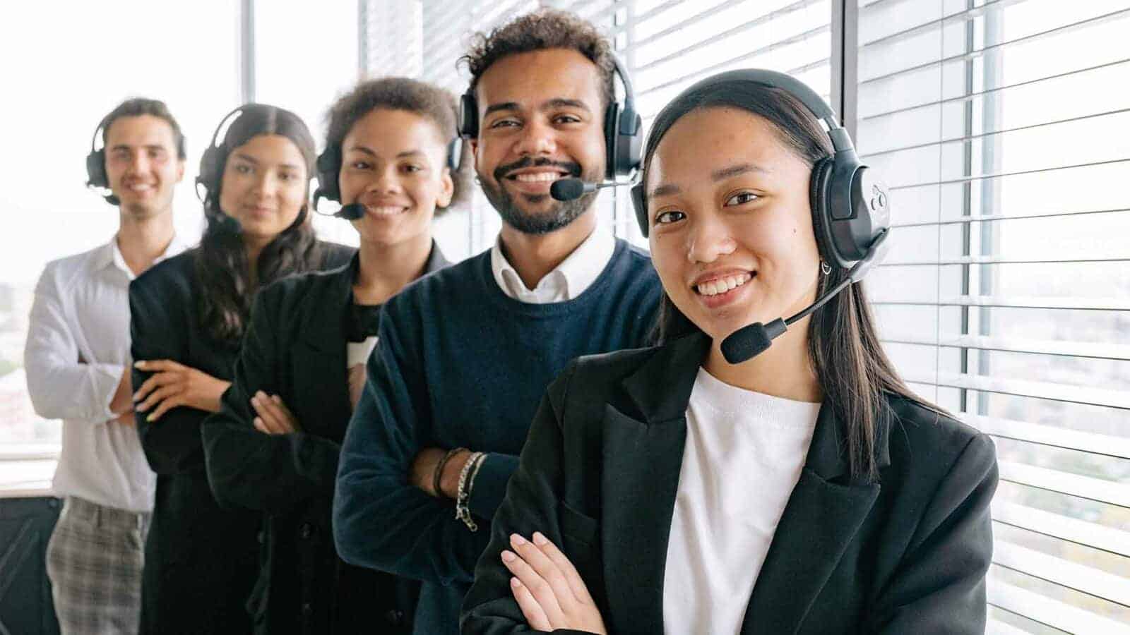 A group of customer service reps poses for a photo.